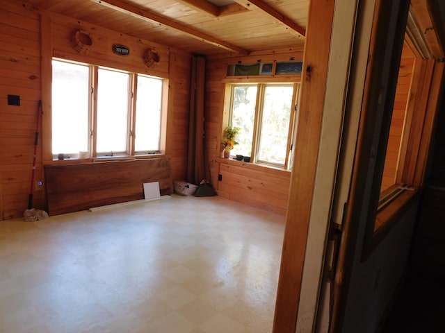 spare room with wooden walls and wood ceiling