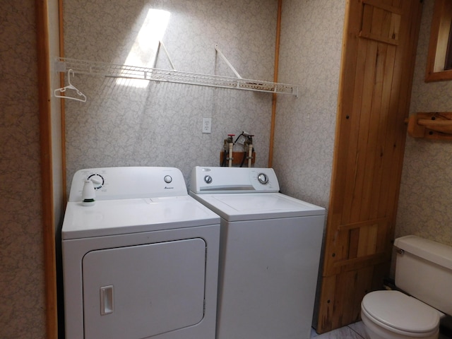 washroom featuring washer and dryer