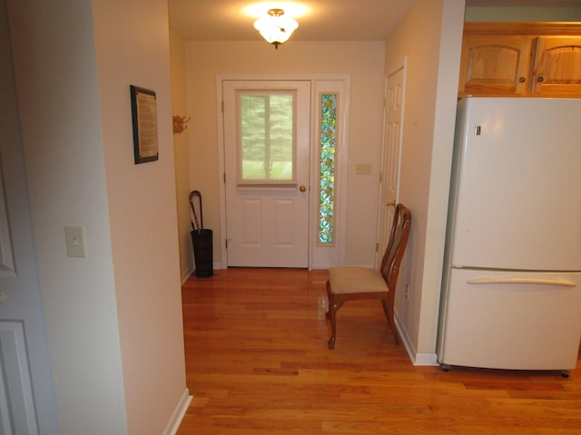 doorway with light hardwood / wood-style floors