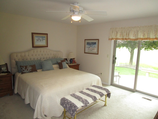 carpeted bedroom featuring ceiling fan and access to exterior