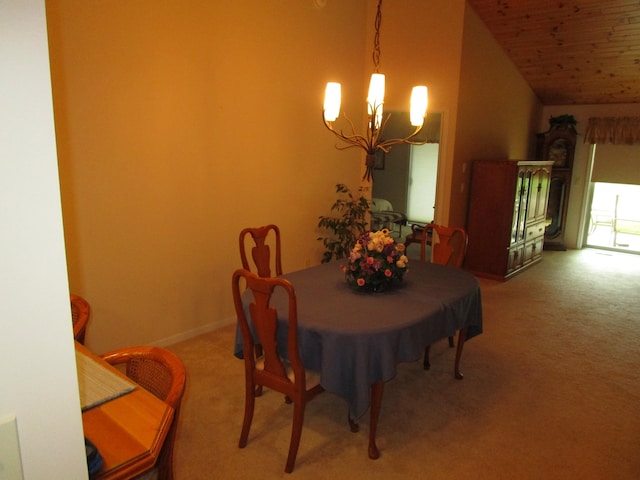 carpeted dining room featuring a notable chandelier and lofted ceiling