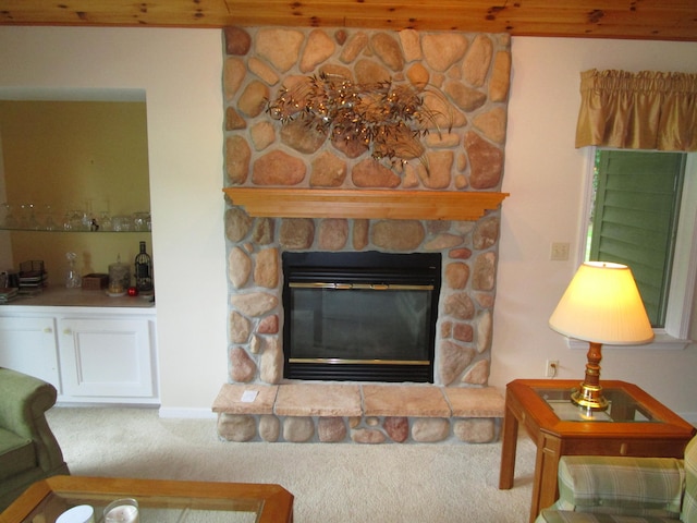 carpeted living room featuring a fireplace