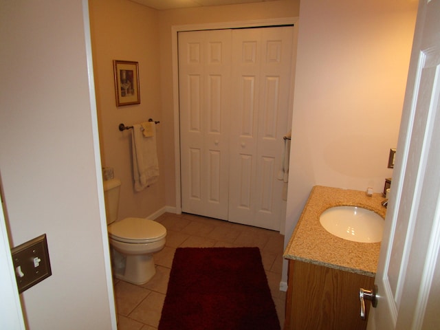 bathroom featuring vanity, toilet, and tile patterned floors