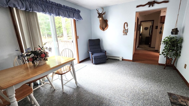 carpeted office with a baseboard heating unit