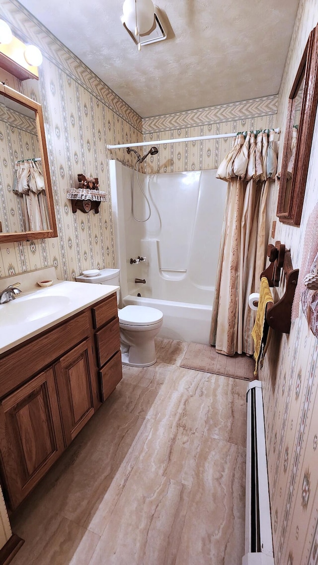 full bathroom featuring shower / bath combo, vanity, and toilet