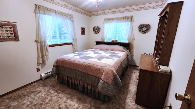 carpeted bedroom with a baseboard radiator