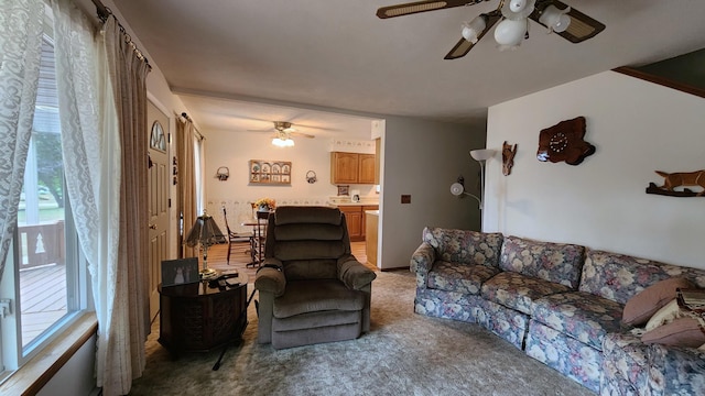 living room with carpet and ceiling fan