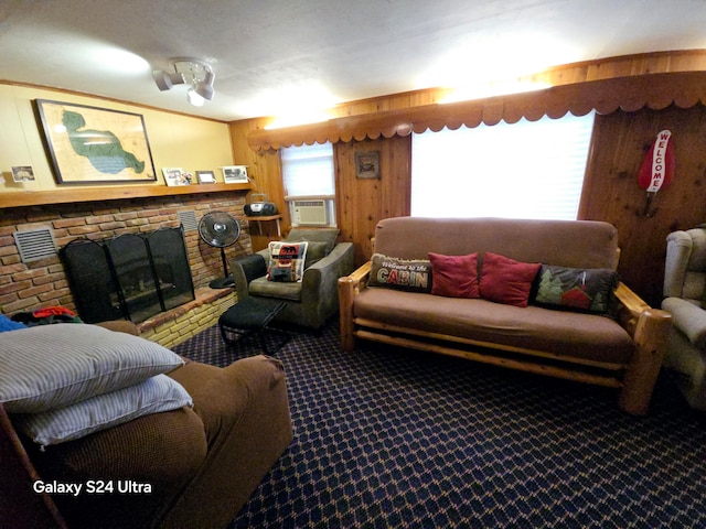 living room with a brick fireplace, carpet floors, and cooling unit