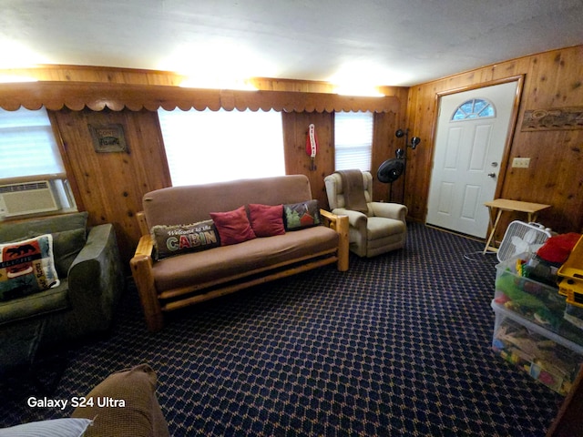 living room with carpet, cooling unit, and wood walls