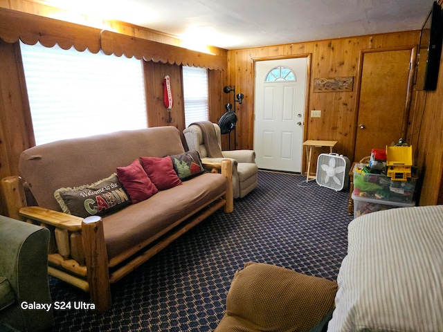 living room featuring wood walls