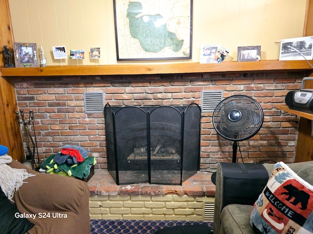 details with wood walls and a fireplace