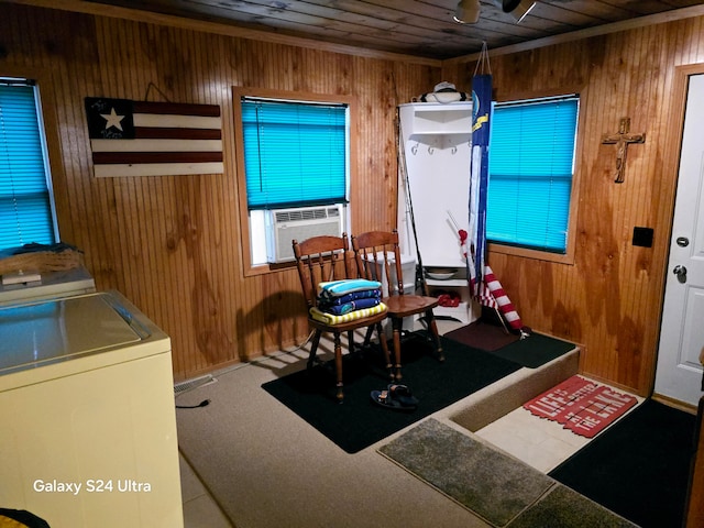 interior space featuring wood walls, wooden ceiling, cooling unit, washer / dryer, and carpet