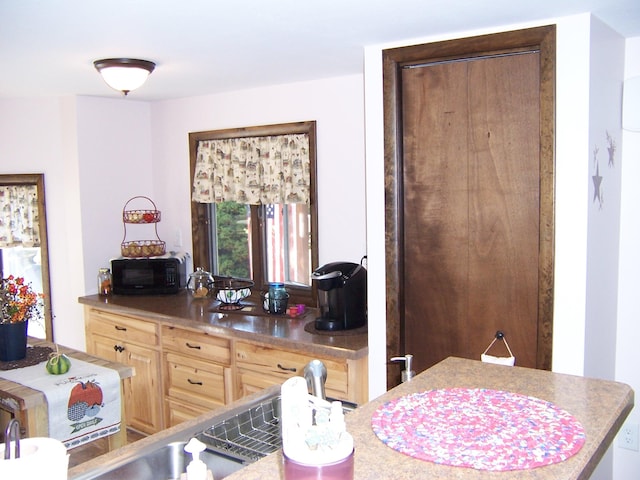 kitchen featuring light brown cabinets