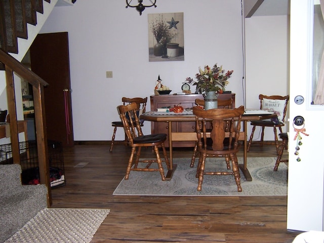 dining room with dark wood-type flooring