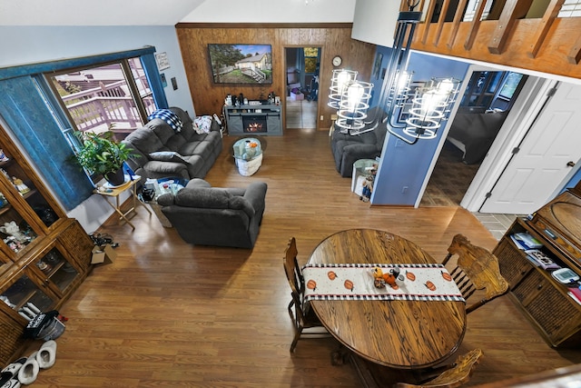 living room with lofted ceiling and hardwood / wood-style flooring