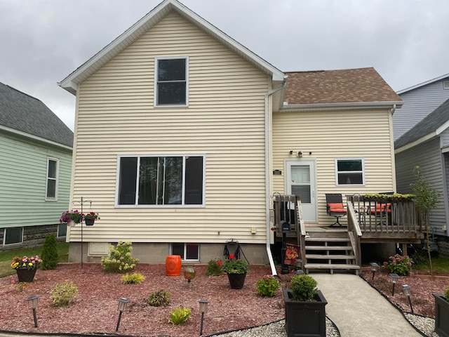 rear view of property with a deck