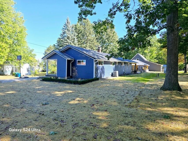 back of property with central AC unit