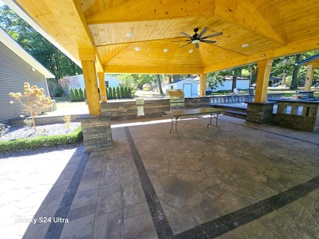 view of patio with ceiling fan and a gazebo