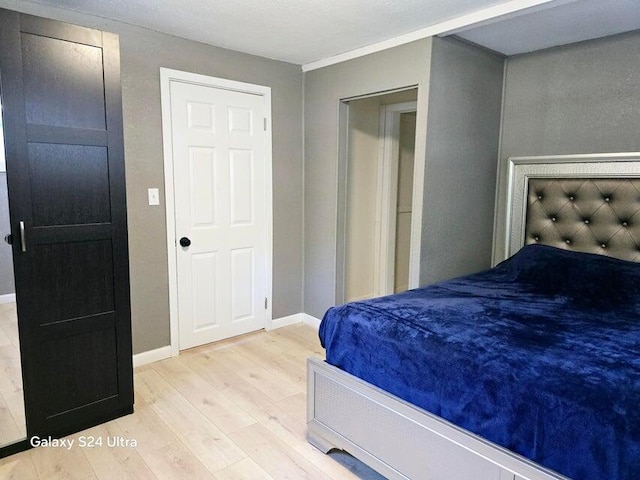 bedroom with light wood-type flooring