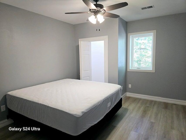 bedroom featuring ceiling fan and hardwood / wood-style flooring