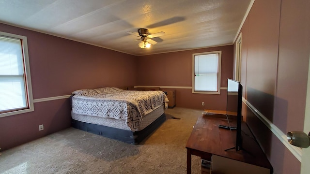 bedroom featuring ceiling fan and carpet floors