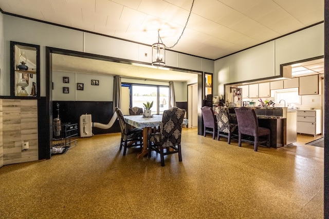 dining room featuring ornamental molding