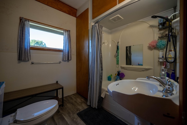 bathroom with toilet, sink, a shower with curtain, crown molding, and hardwood / wood-style floors