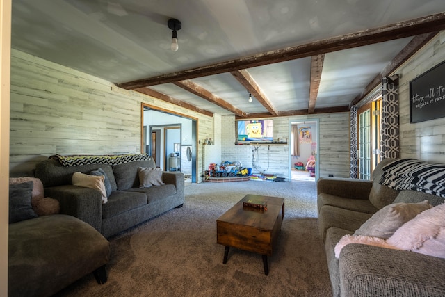 living room with beamed ceiling, wooden walls, and carpet