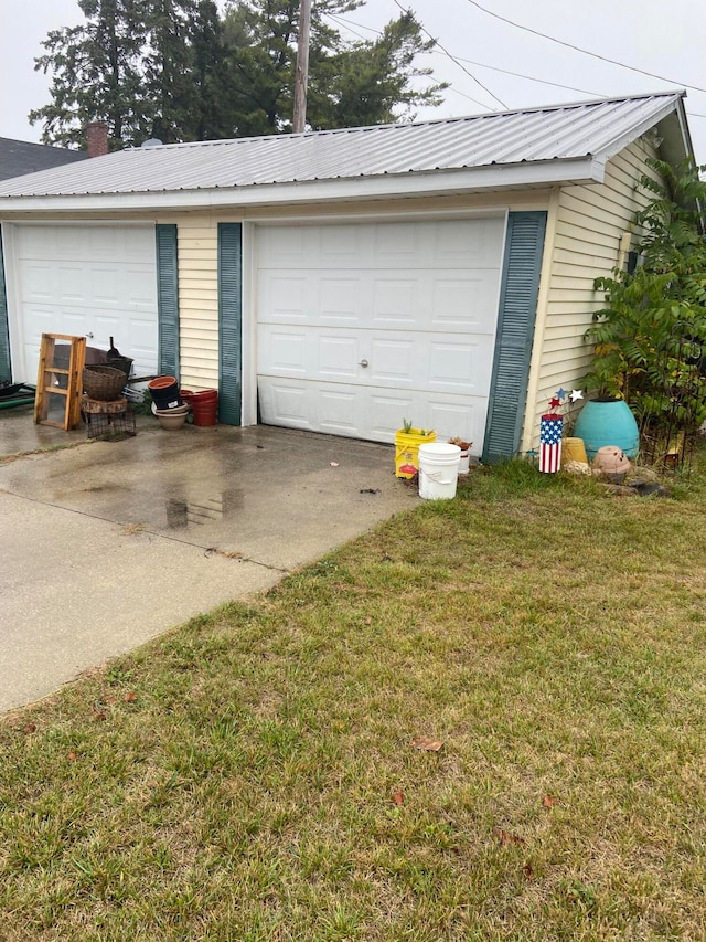 garage featuring a yard