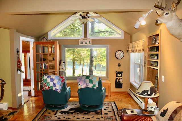 living room with a baseboard heating unit, vaulted ceiling, and light parquet flooring