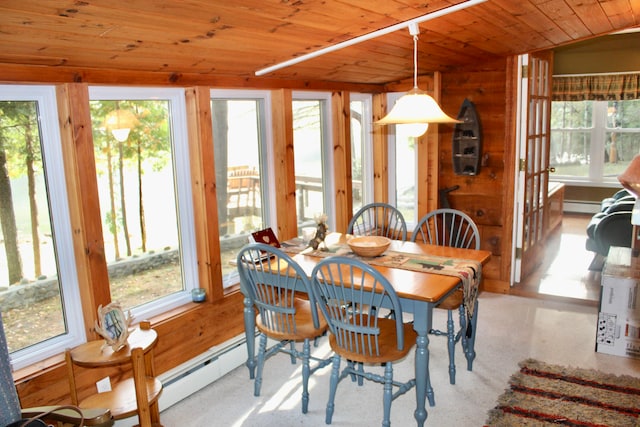 carpeted dining room featuring wooden ceiling, vaulted ceiling, and a baseboard radiator