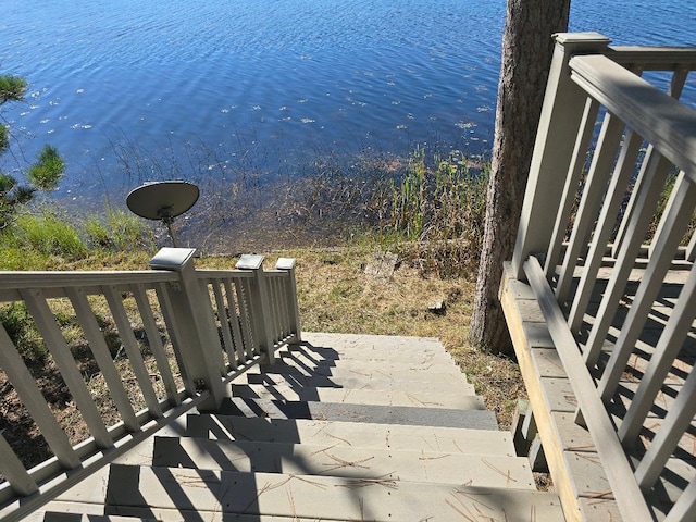 exterior space featuring a water view and a balcony