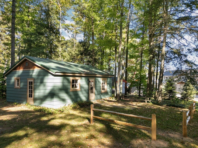 view of side of home with a lawn