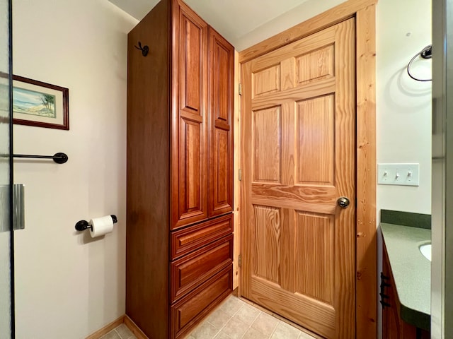 bathroom with tile patterned flooring and vanity