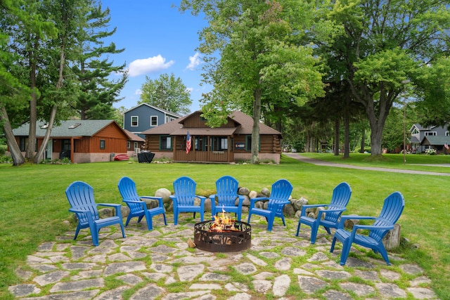 view of yard with a fire pit