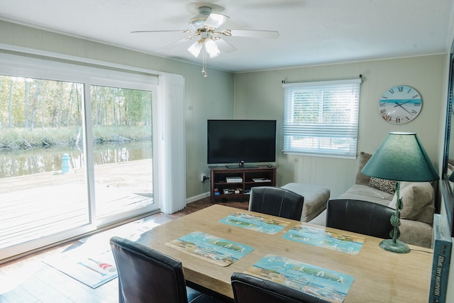 living room featuring ornamental molding and ceiling fan