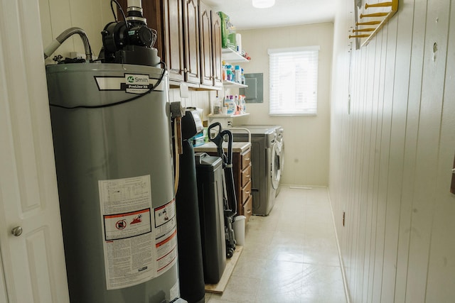 utility room with separate washer and dryer and gas water heater