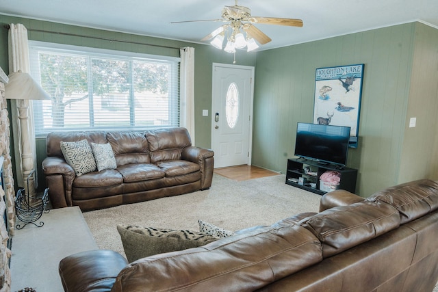 living room with carpet and ceiling fan