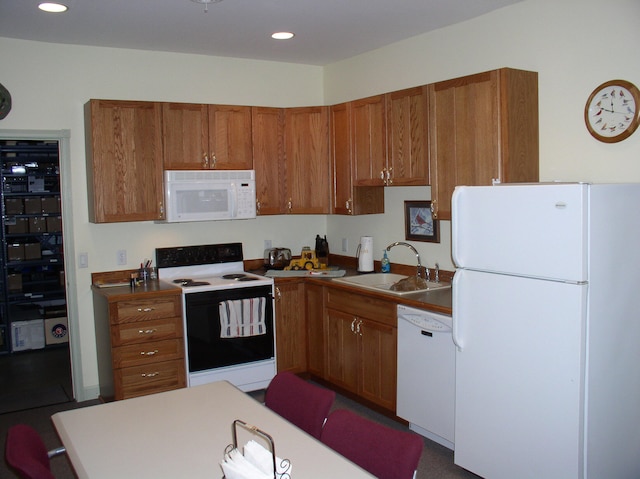 kitchen featuring sink and white appliances