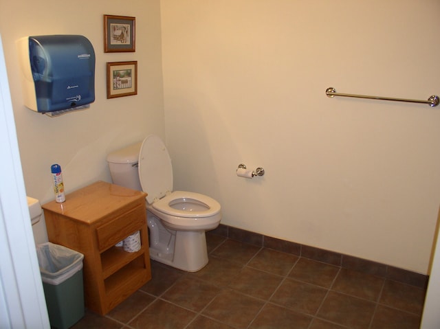 bathroom featuring toilet and tile patterned floors