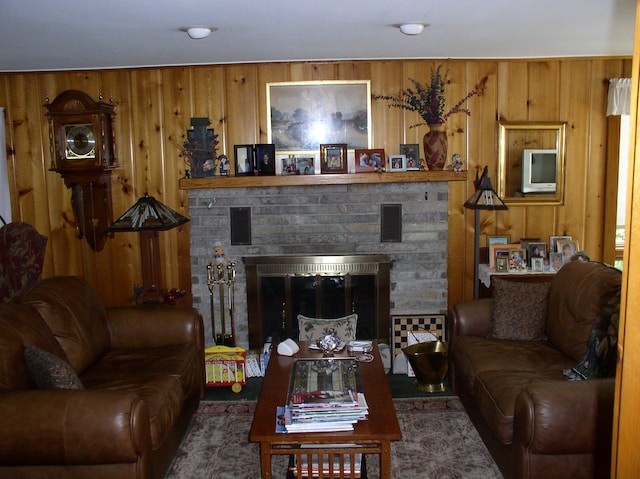 living room featuring wood walls