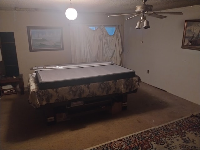 bedroom with a textured ceiling and ceiling fan