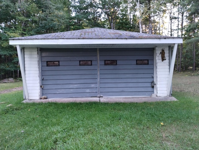 garage with a lawn