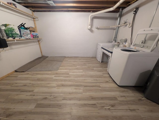 washroom featuring light hardwood / wood-style floors and independent washer and dryer