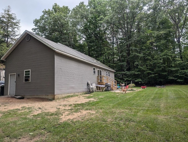 view of property exterior with a yard