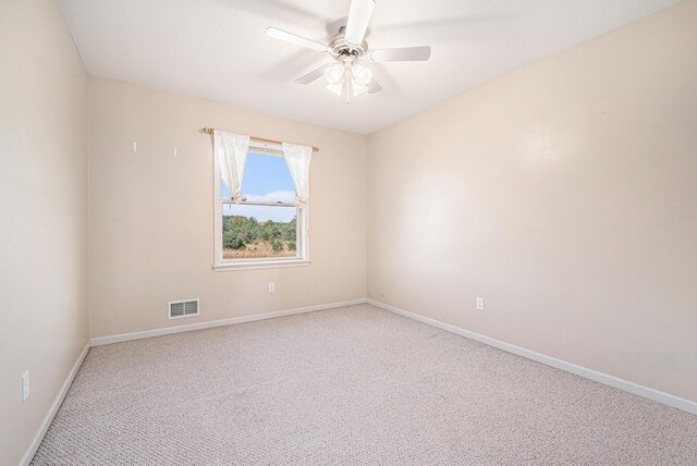 interior space with vaulted ceiling and light carpet