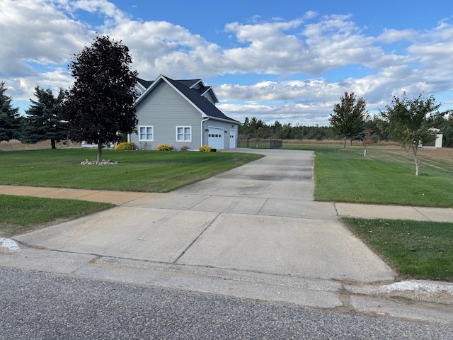 view of home's exterior with a garage, concrete driveway, and a lawn