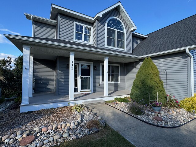 view of side of property with a garage and a yard