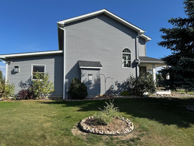 view of home's exterior featuring a yard