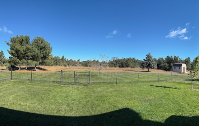 view of yard with a rural view and fence